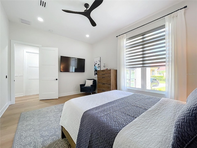 bedroom featuring ceiling fan and light hardwood / wood-style flooring