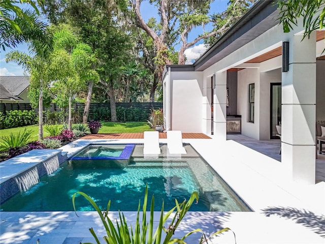 view of pool with pool water feature, an in ground hot tub, and a patio area