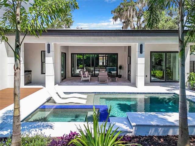 view of swimming pool featuring a patio area