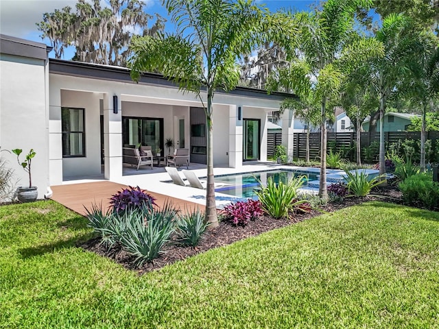 view of pool with a lawn