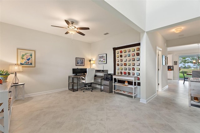 tiled office featuring ceiling fan