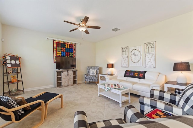 living room featuring light tile patterned flooring and ceiling fan