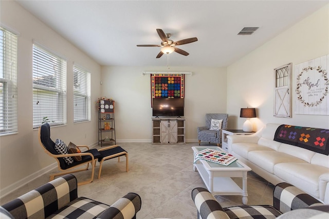 living room with light tile patterned floors and ceiling fan