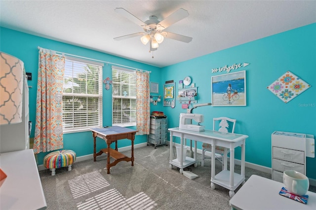 rec room featuring a textured ceiling, carpet flooring, and ceiling fan