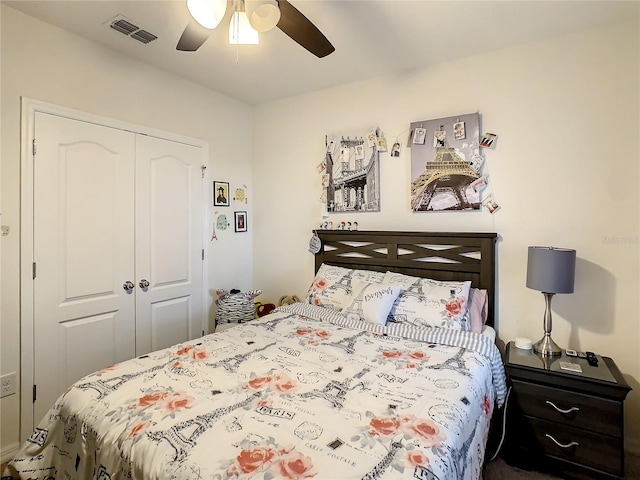 bedroom with ceiling fan and a closet