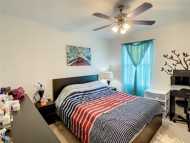 bedroom with light carpet and ceiling fan