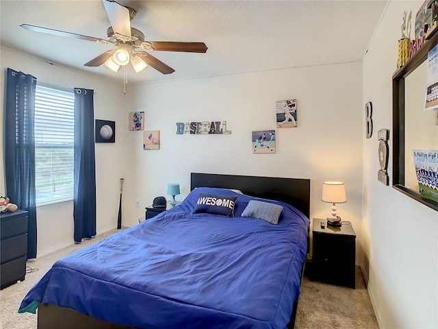 bedroom with light colored carpet and ceiling fan