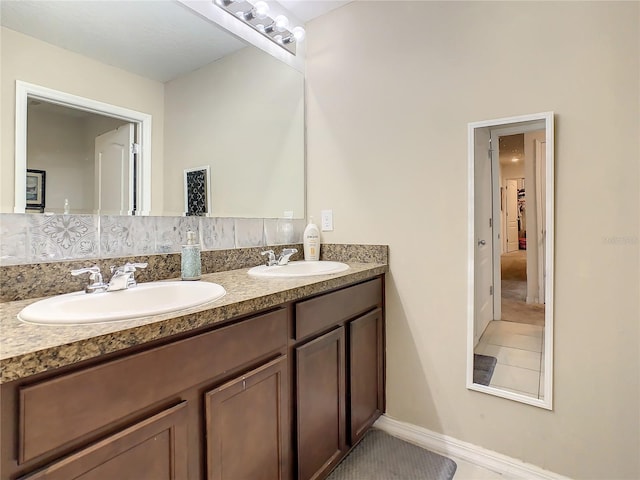 bathroom with backsplash and vanity