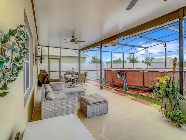 sunroom / solarium featuring ceiling fan