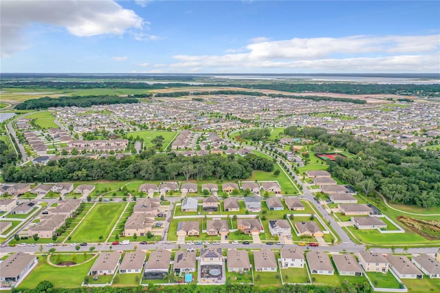 1927 Partin Terrace Rd, Kissimmee, FL 34744 - aerial overview of property's location with nearby suburban area and a large body of water