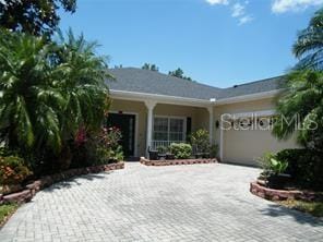 single story home featuring a garage