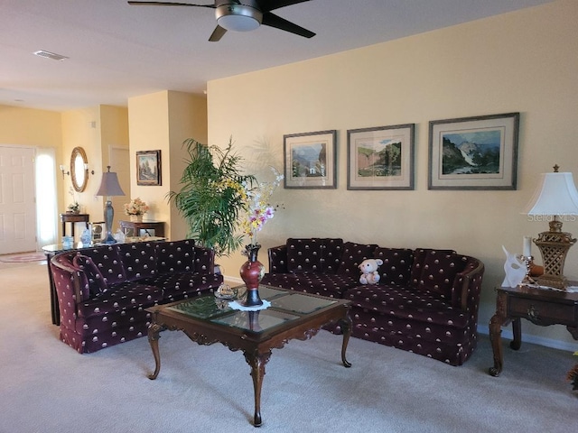 carpeted living room featuring ceiling fan