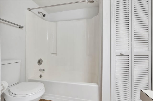 bathroom with toilet and tub / shower combination