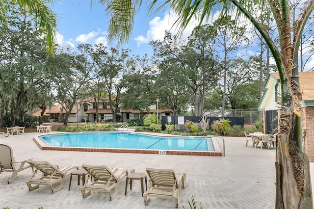 view of swimming pool with a patio