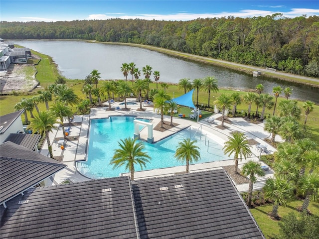 view of pool with a water view and a patio area