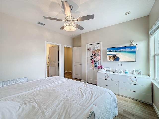 bedroom featuring ceiling fan and light hardwood / wood-style floors