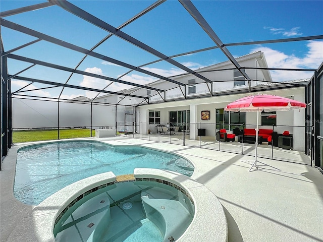 view of swimming pool with glass enclosure, an in ground hot tub, and a patio