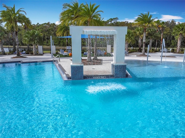 view of pool with pool water feature