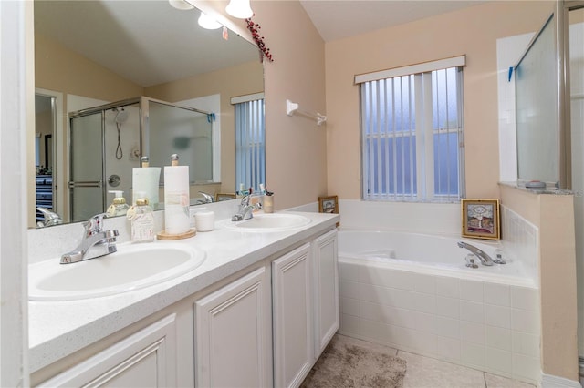 bathroom with tile patterned floors, vanity, and independent shower and bath