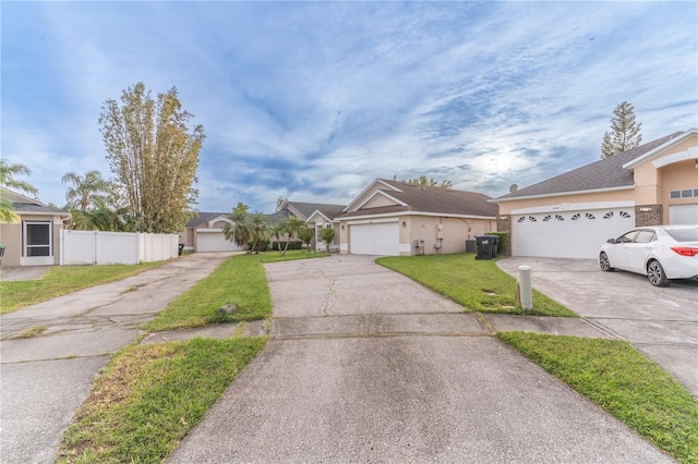 ranch-style home with a front yard and a garage