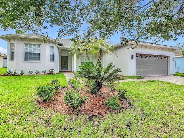 ranch-style home with a front yard and a garage