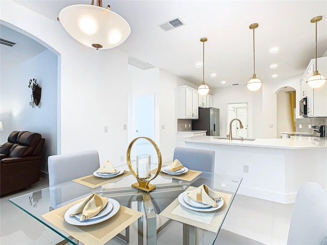 dining space featuring sink