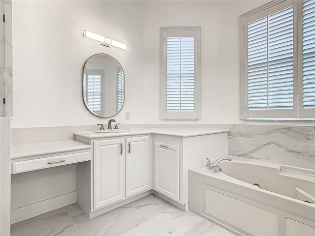 bathroom with vanity and a tub to relax in