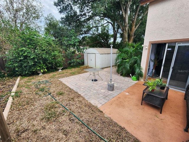 view of patio featuring a storage unit