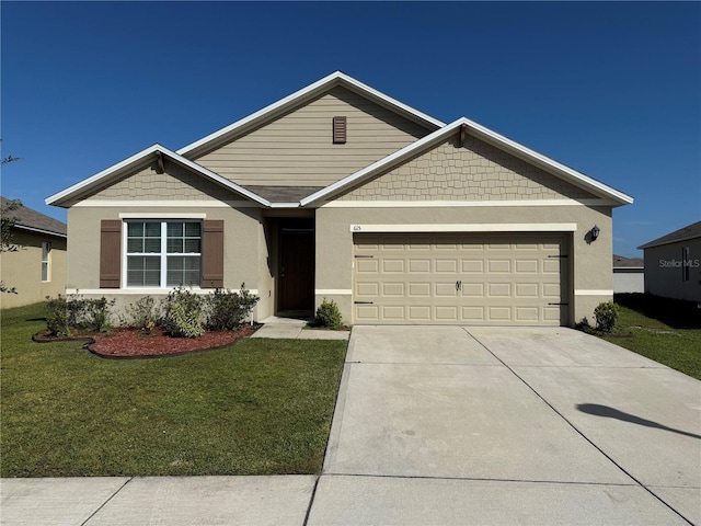 view of front of home featuring a front yard and a garage