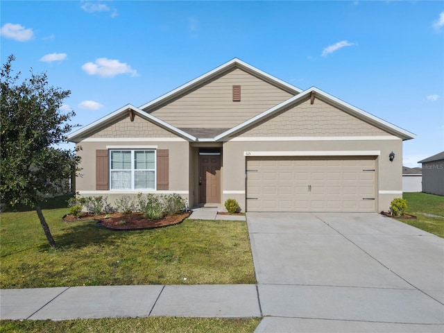 view of front of property with a front yard and a garage