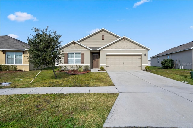 view of front facade with a front yard and a garage