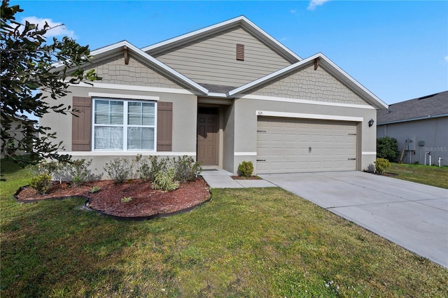 view of front facade featuring a garage and a front lawn