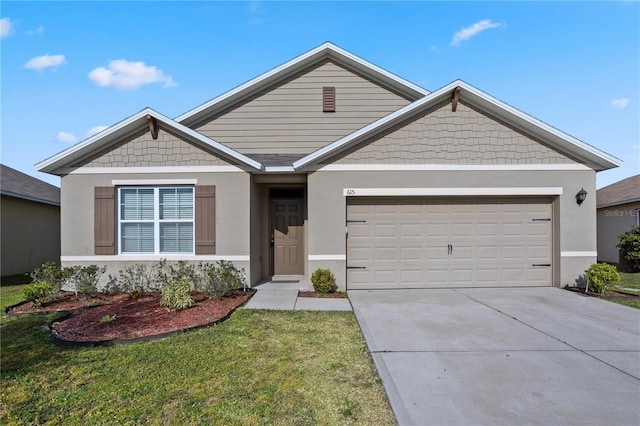 view of front of home featuring a front yard and a garage