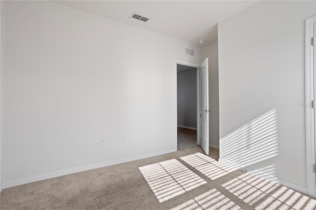 unfurnished bedroom with light colored carpet