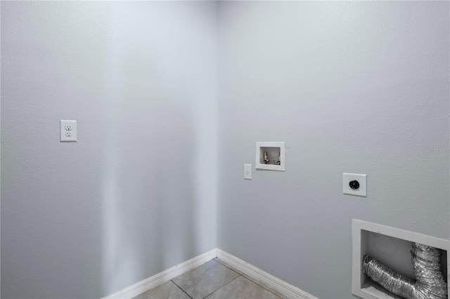 laundry area with hookup for a washing machine, light tile patterned flooring, and hookup for an electric dryer