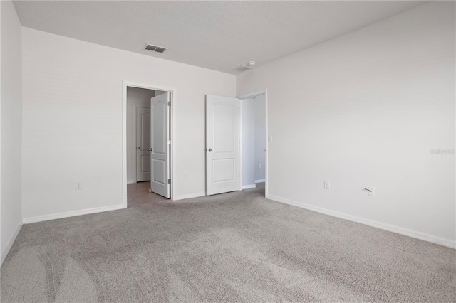 unfurnished bedroom with light colored carpet