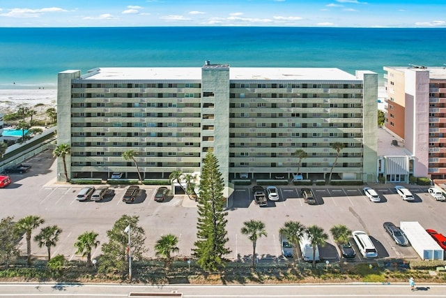 drone / aerial view featuring a view of the beach and a water view