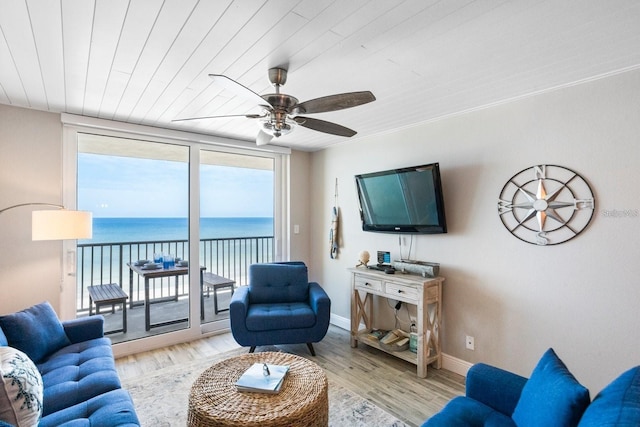 living room featuring ceiling fan, wooden ceiling, and light hardwood / wood-style floors