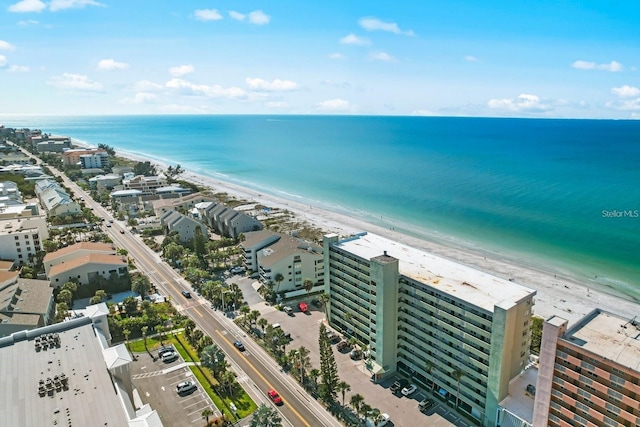 birds eye view of property with a beach view and a water view