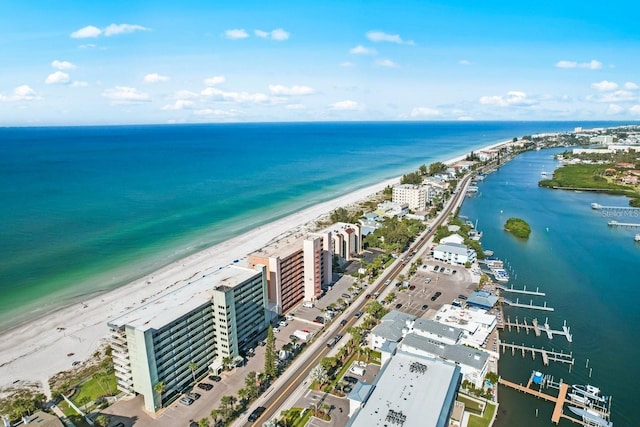 drone / aerial view with a water view and a view of the beach