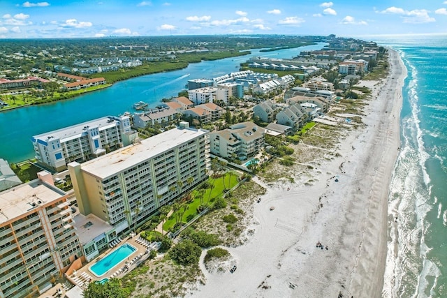 bird's eye view featuring a view of the beach and a water view