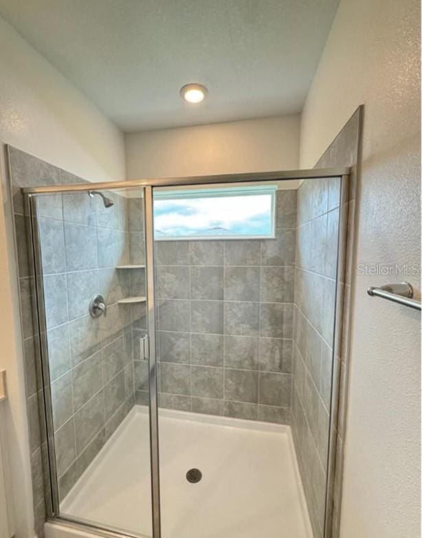 bathroom with an enclosed shower