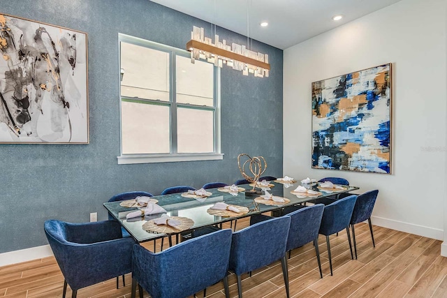 dining room featuring plenty of natural light and wood-type flooring