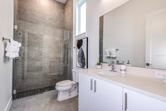 bathroom featuring walk in shower, vanity, and toilet