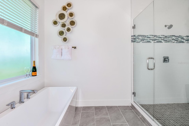 bathroom with tile patterned floors and plus walk in shower