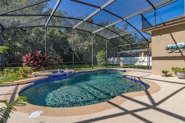 view of pool featuring glass enclosure, a patio area, and an in ground hot tub