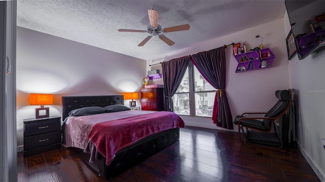 bedroom with a textured ceiling, dark hardwood / wood-style floors, and ceiling fan