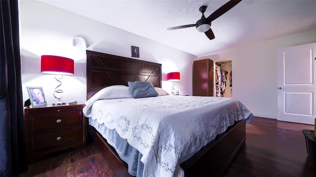 bedroom featuring ceiling fan and dark hardwood / wood-style flooring