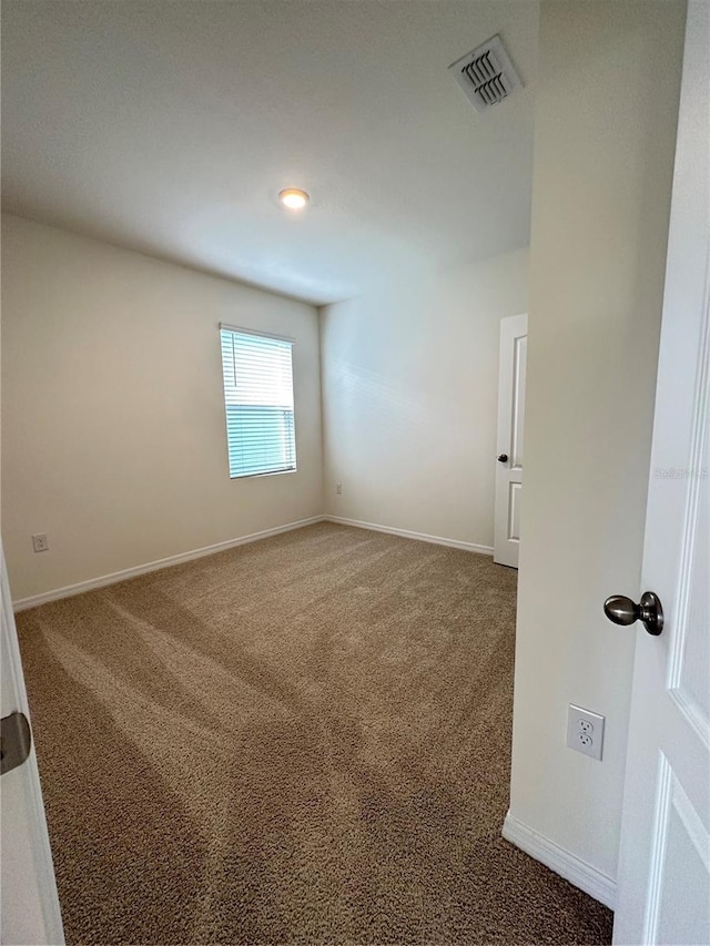 empty room featuring carpet floors