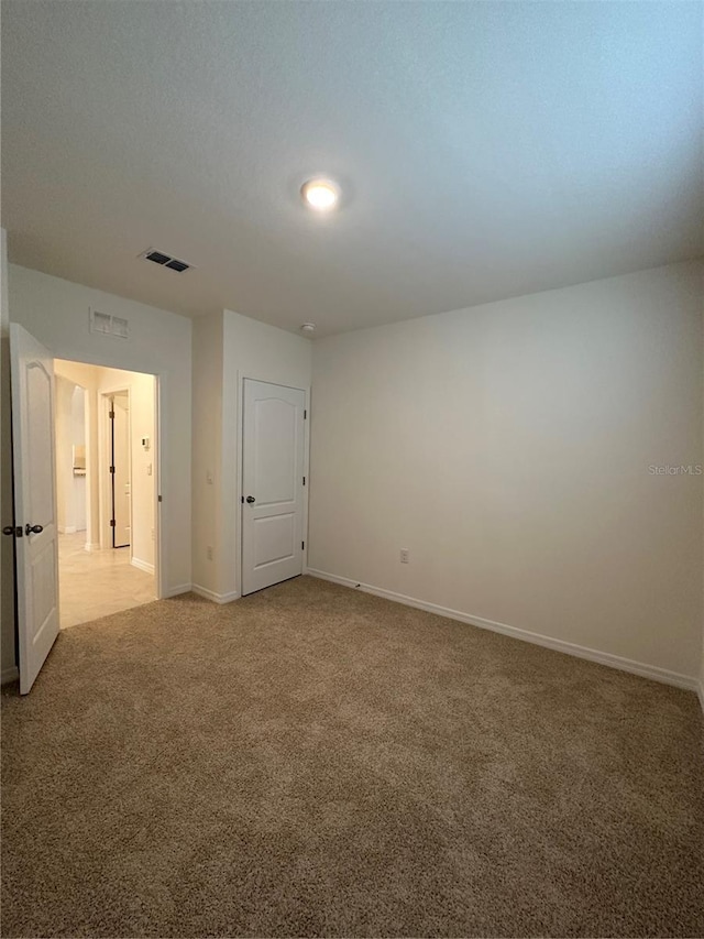 unfurnished room with carpet